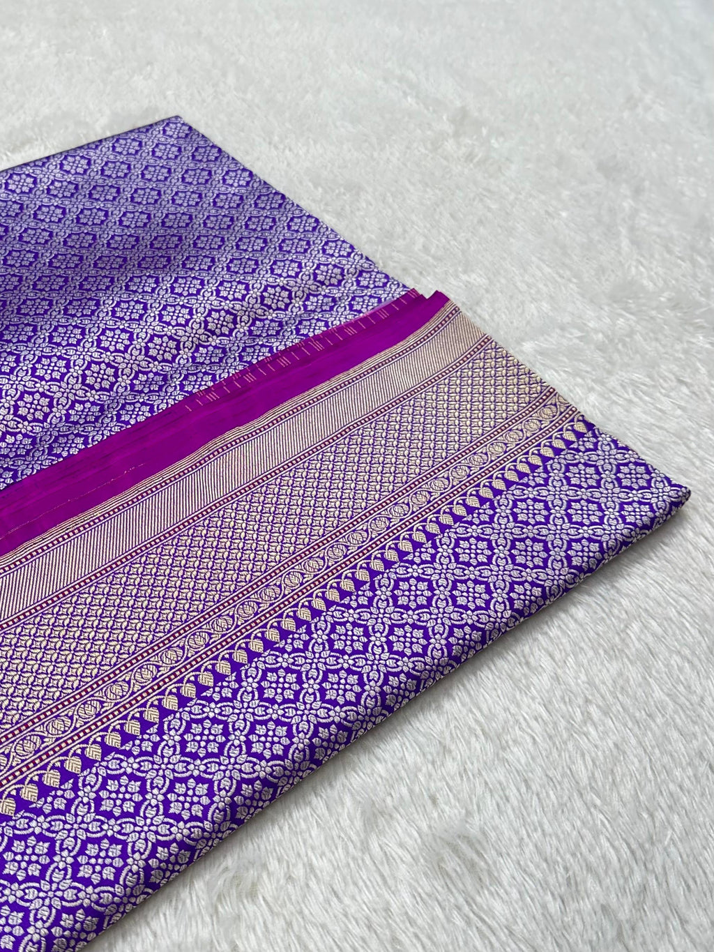 A Beautiful and Delicate Purple saree that appears to be a contemporary take on classic Kadua Banarasi weaving.