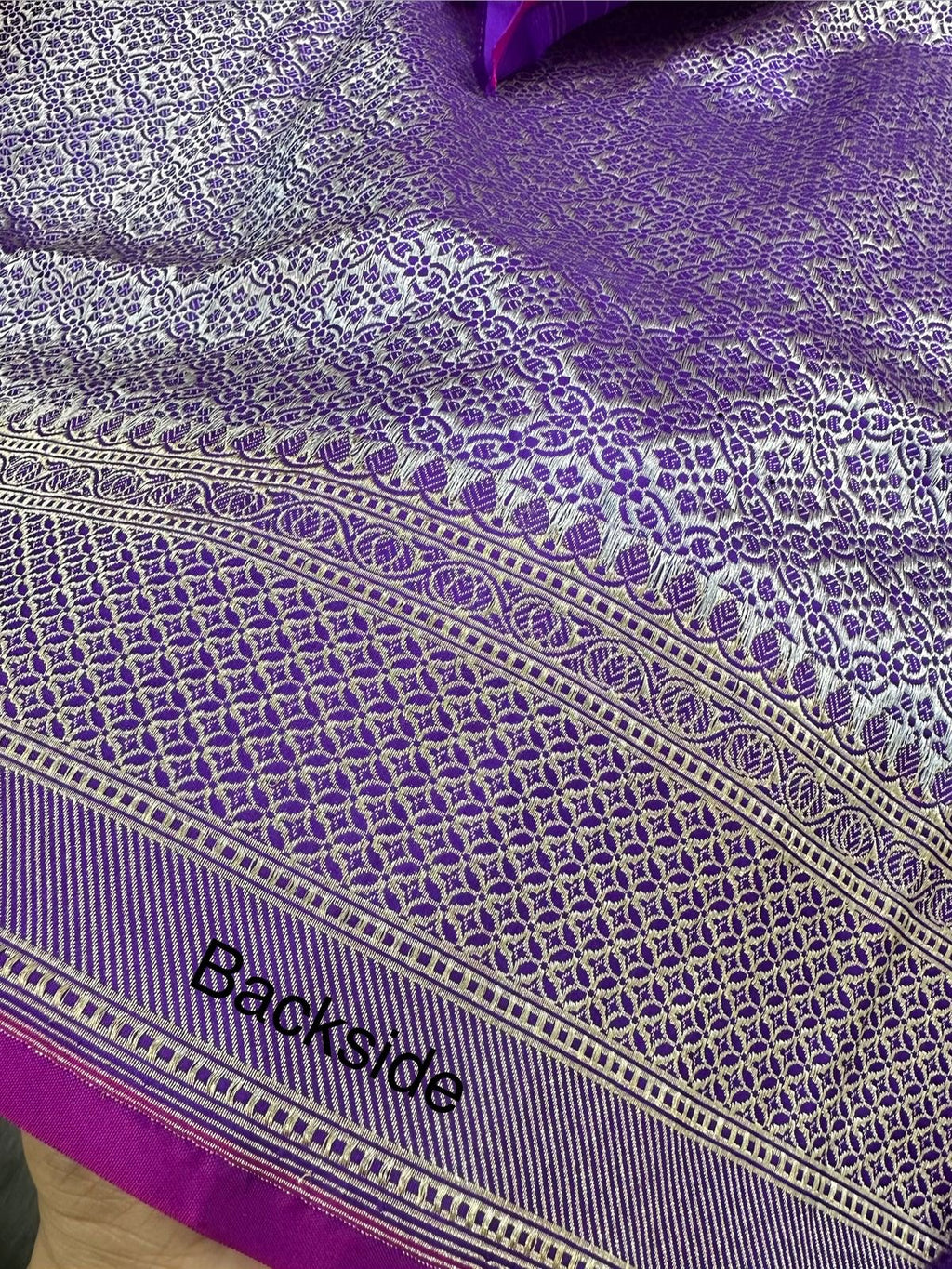 A Beautiful and Delicate Purple saree that appears to be a contemporary take on classic Kadua Banarasi weaving.