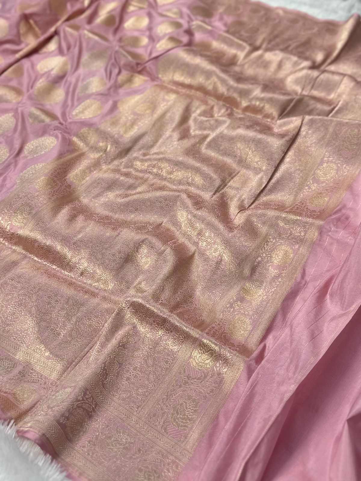 Pure katan silk banarasi saree woven with golden zari in buta pattern