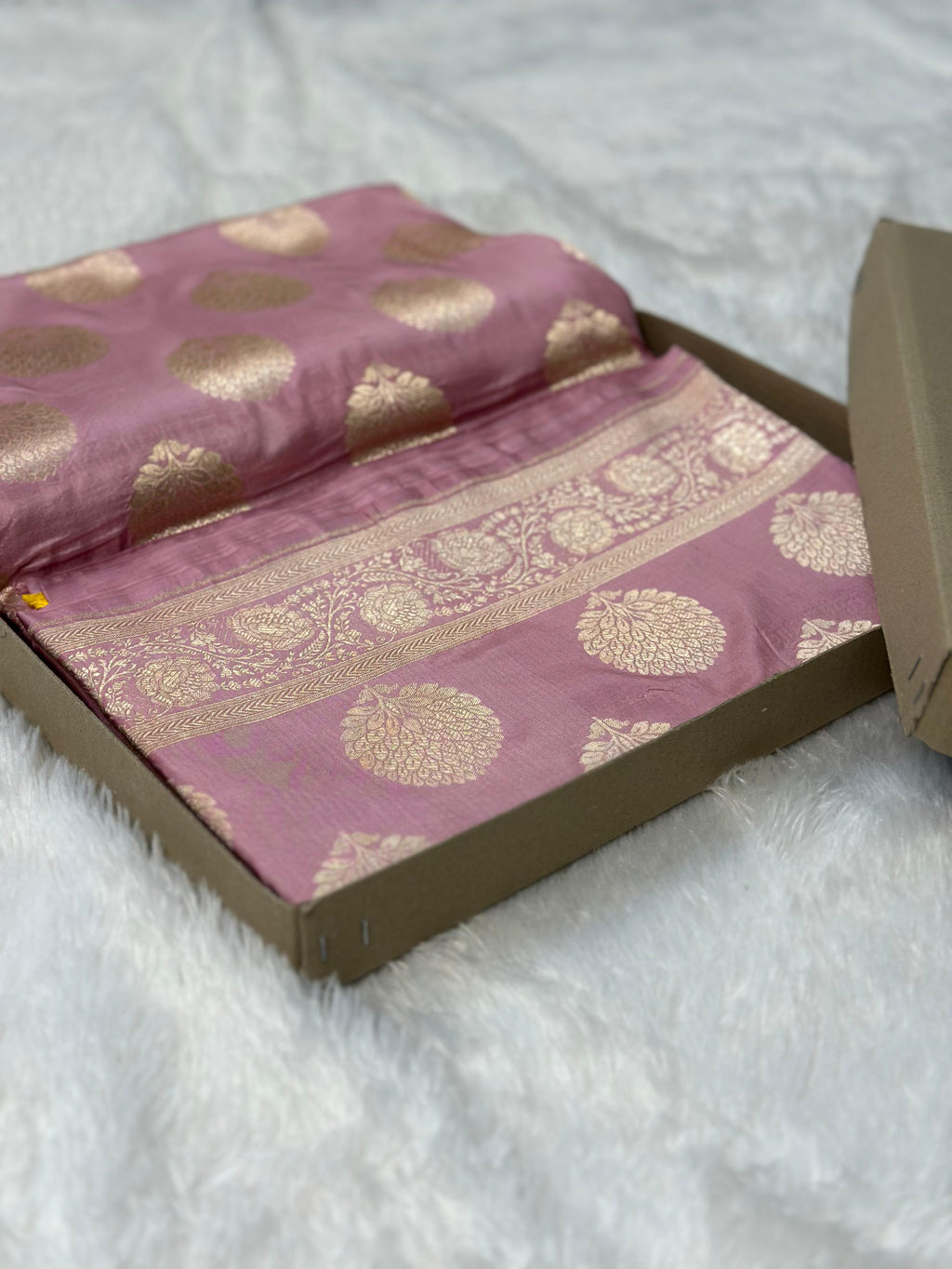 Pure katan silk banarasi saree woven with golden zari in buta pattern
